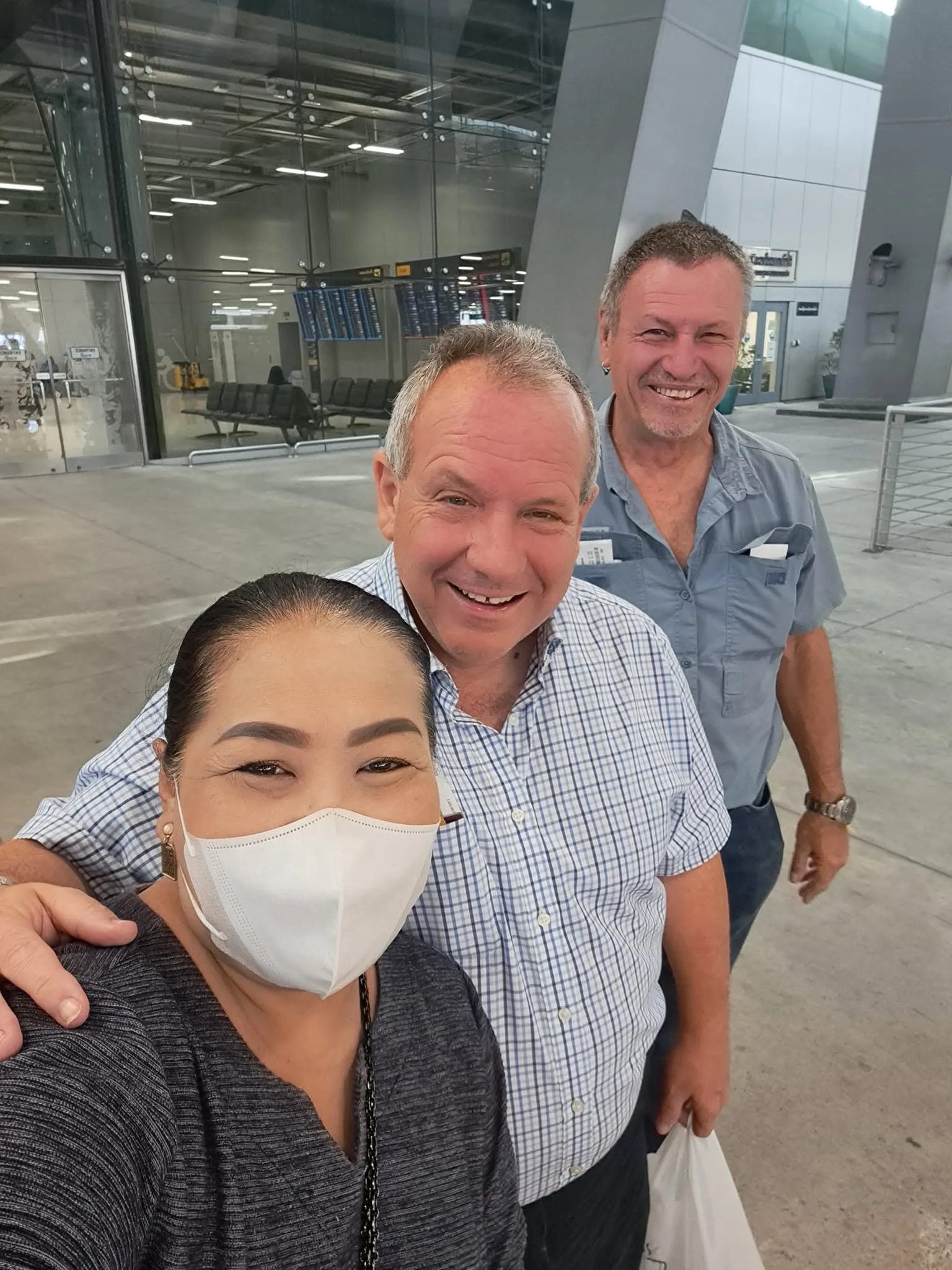 Ms. Mam welcoming two customers at the airport