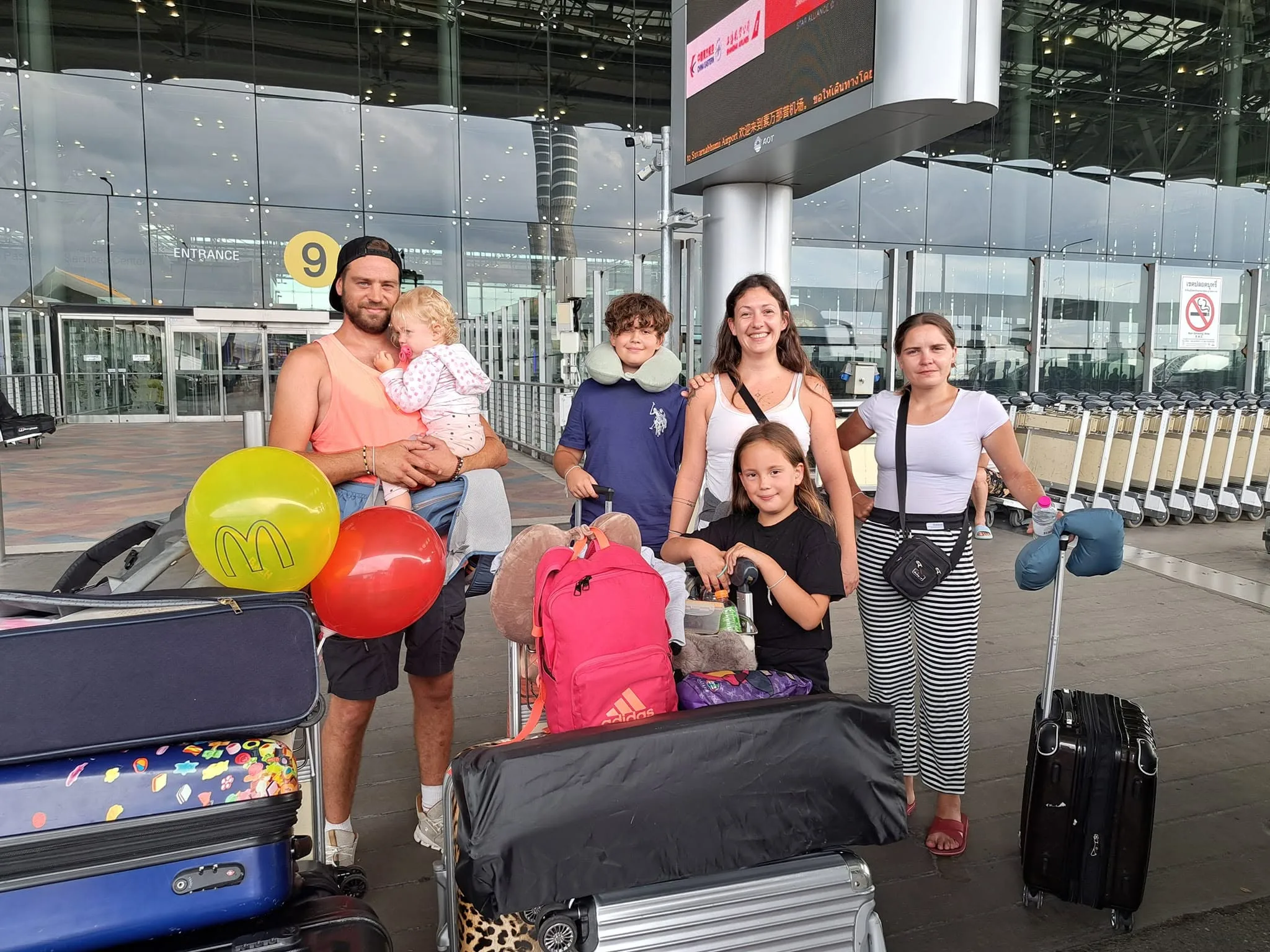 A family group welcomed at the airport