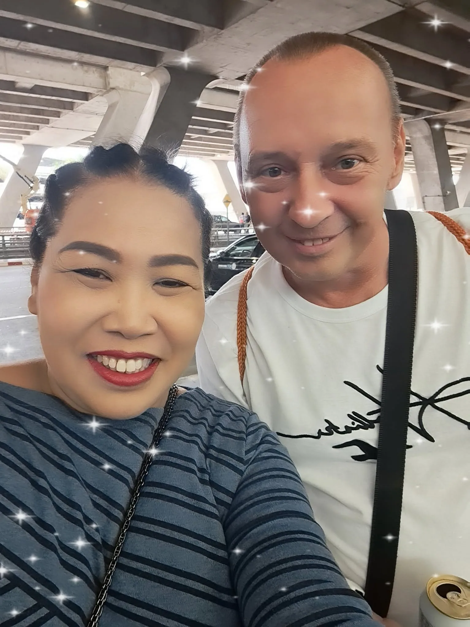 Ms. Mam with a customer at the airport